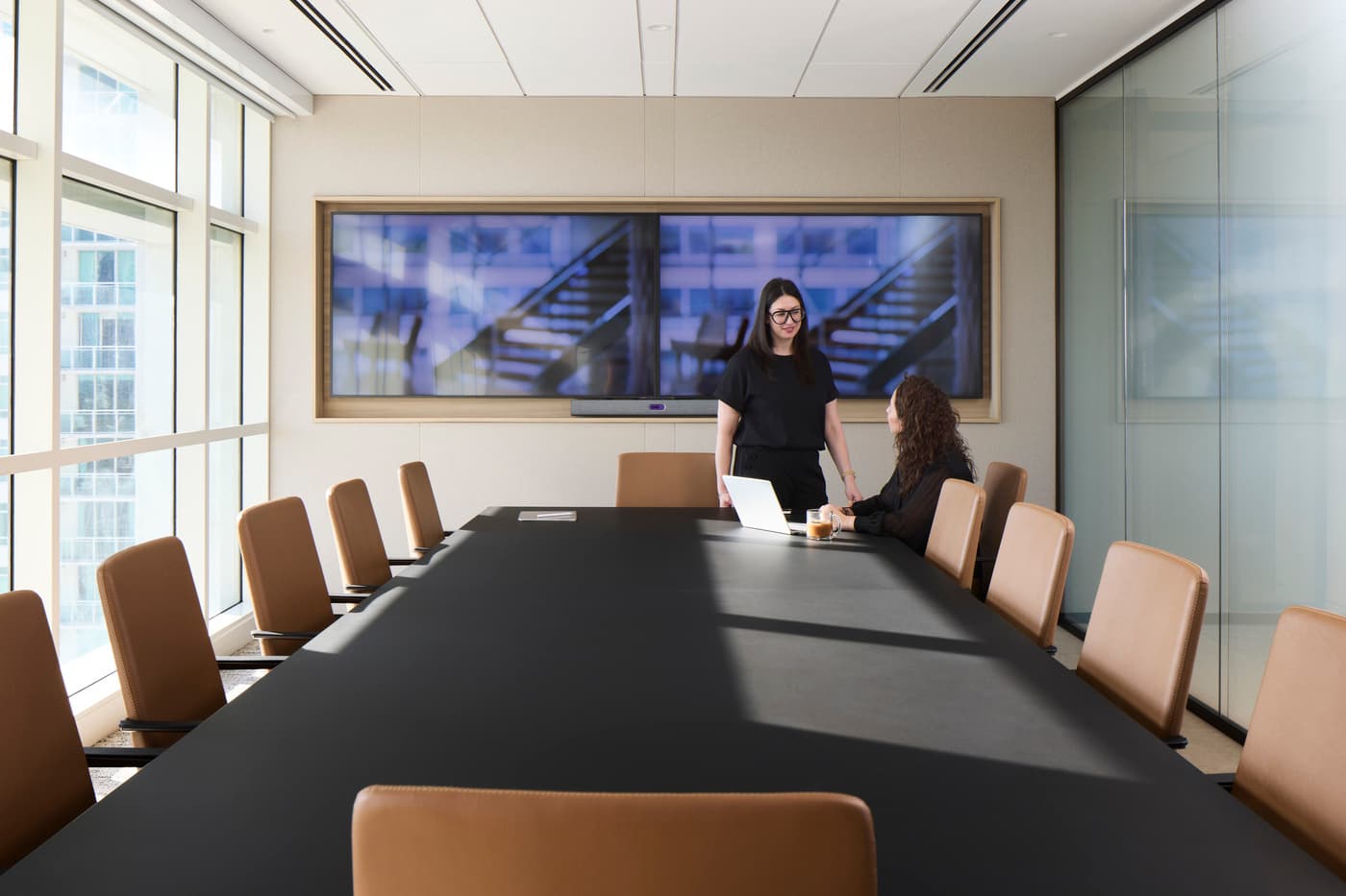 Venable's Miami office: reception with a marble desk beneath a coffered walnut ceiling, conference rooms beyond, photograph 3