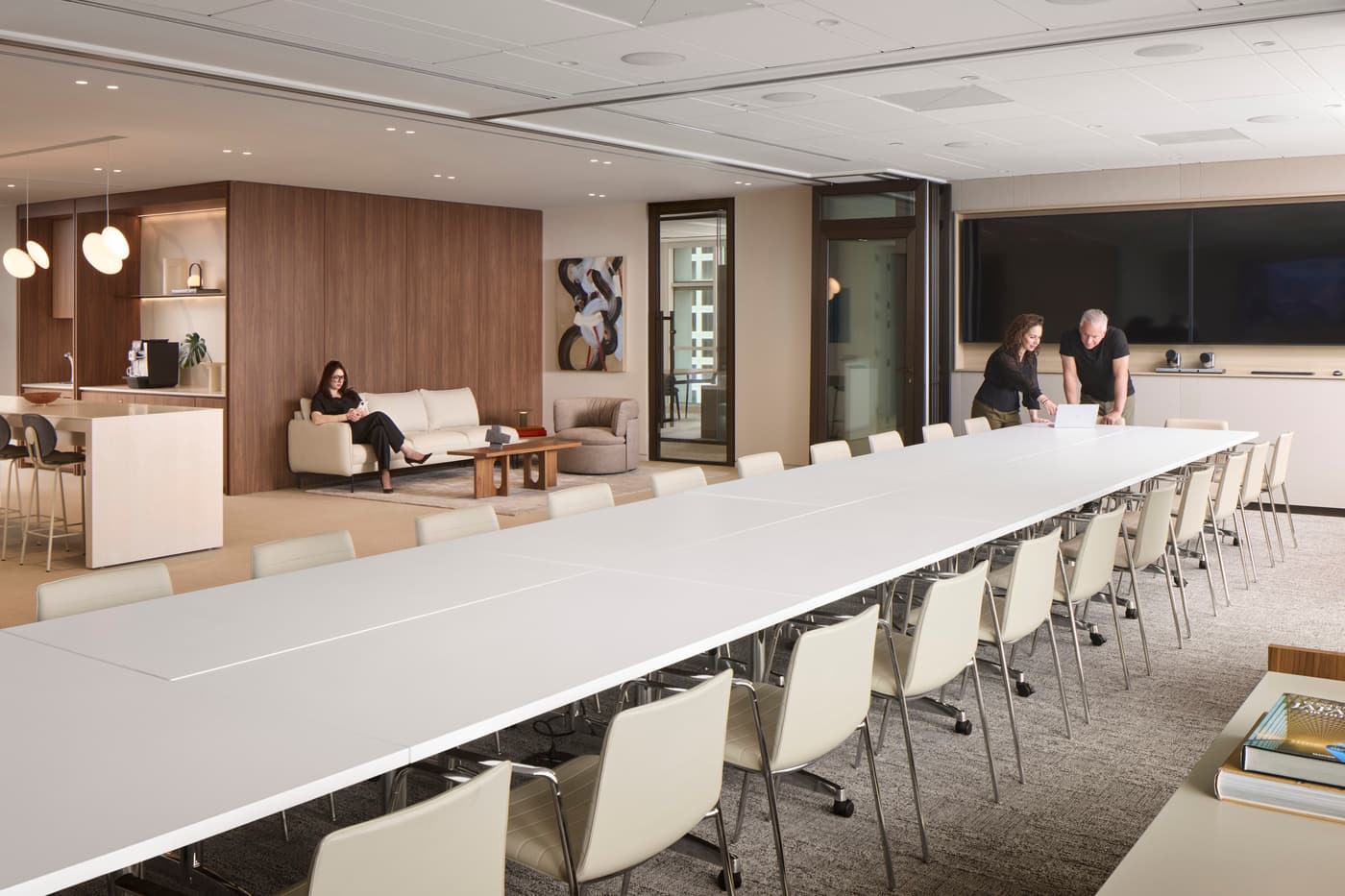 Venable's Miami office: reception with a marble desk beneath a coffered walnut ceiling, conference rooms beyond, photograph 4