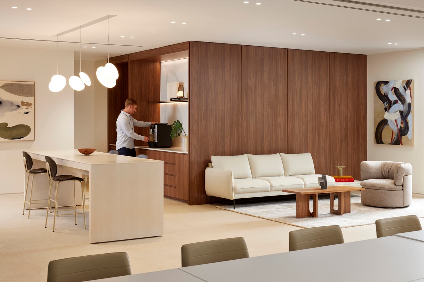 Venable's Miami office: reception with a marble desk beneath a coffered walnut ceiling, conference rooms beyond, photograph 6