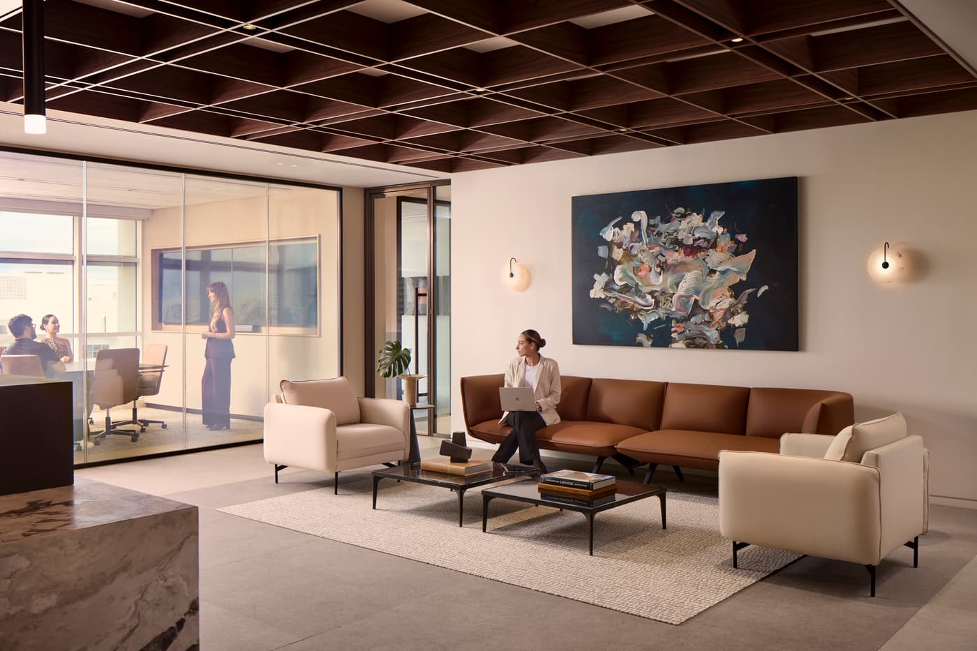 Venable's Miami office: reception with a marble desk beneath a coffered walnut ceiling, conference rooms beyond, photograph 2