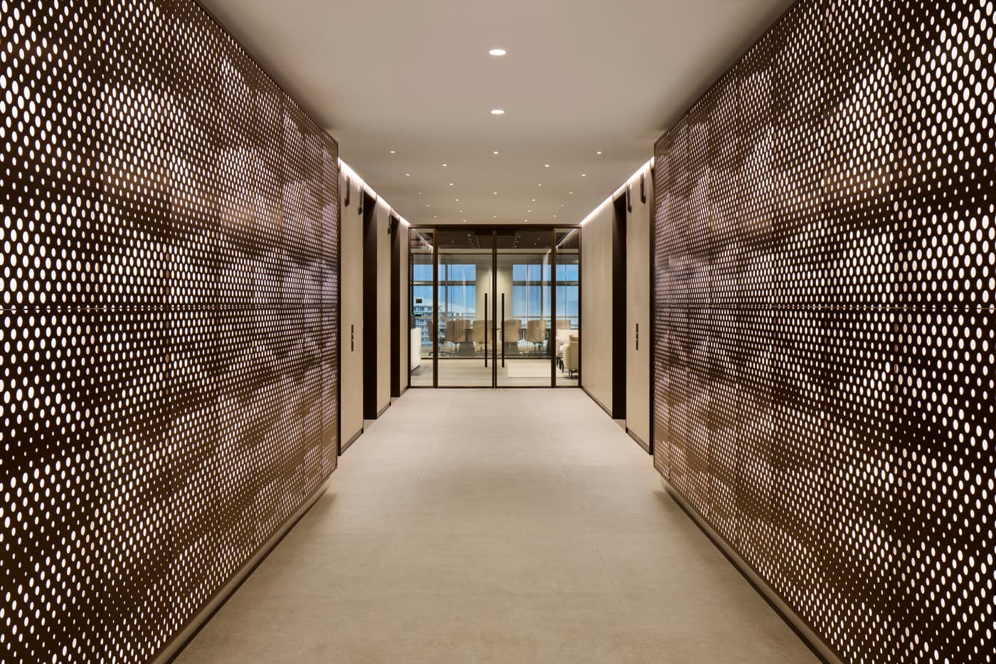 Venable's Miami office: reception with a marble desk beneath a coffered walnut ceiling, conference rooms beyond, photograph 11