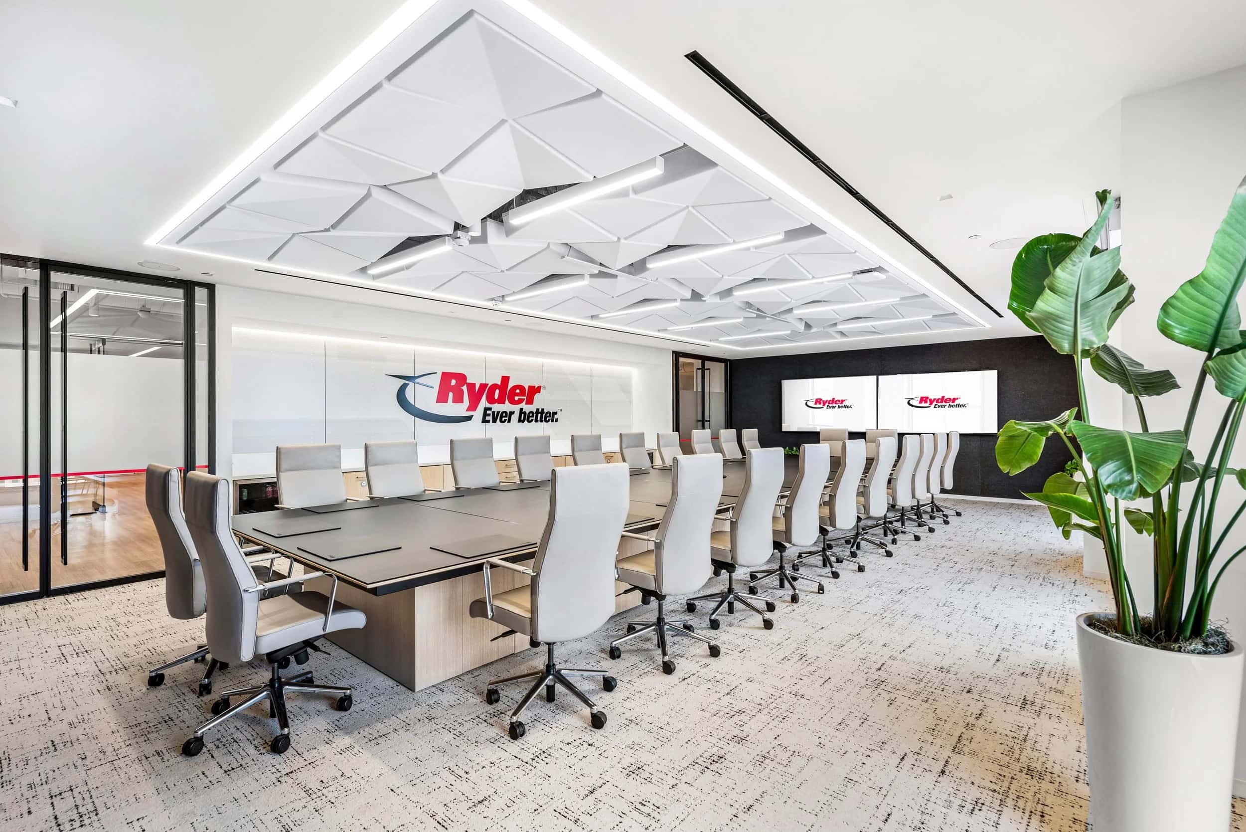 Ryder System boardroom with a long conference table under a sculpted ceiling